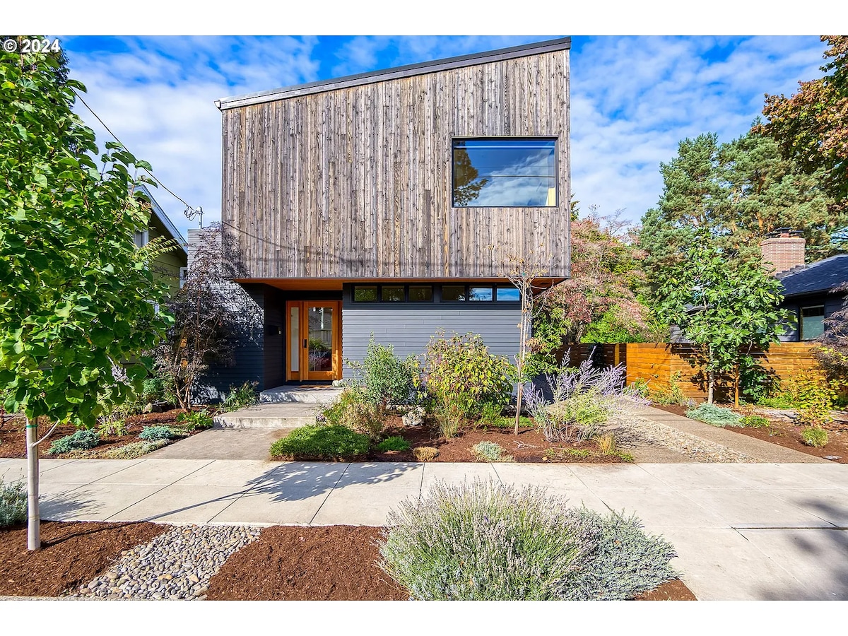 Modern cedar-clad home exterior with landscaped front yard in South Tabor Portland