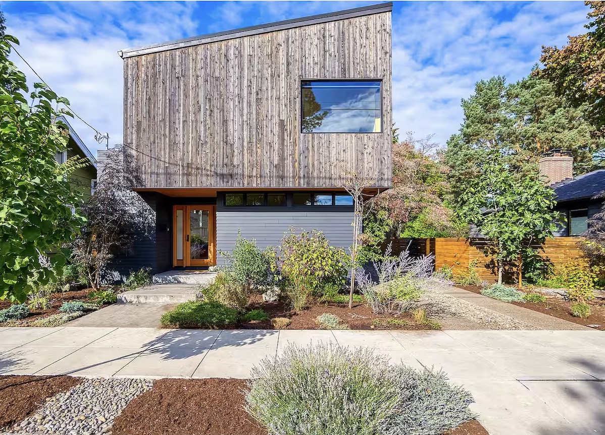 Modern cedar-clad home exterior with landscaped front yard in South Tabor Portland
